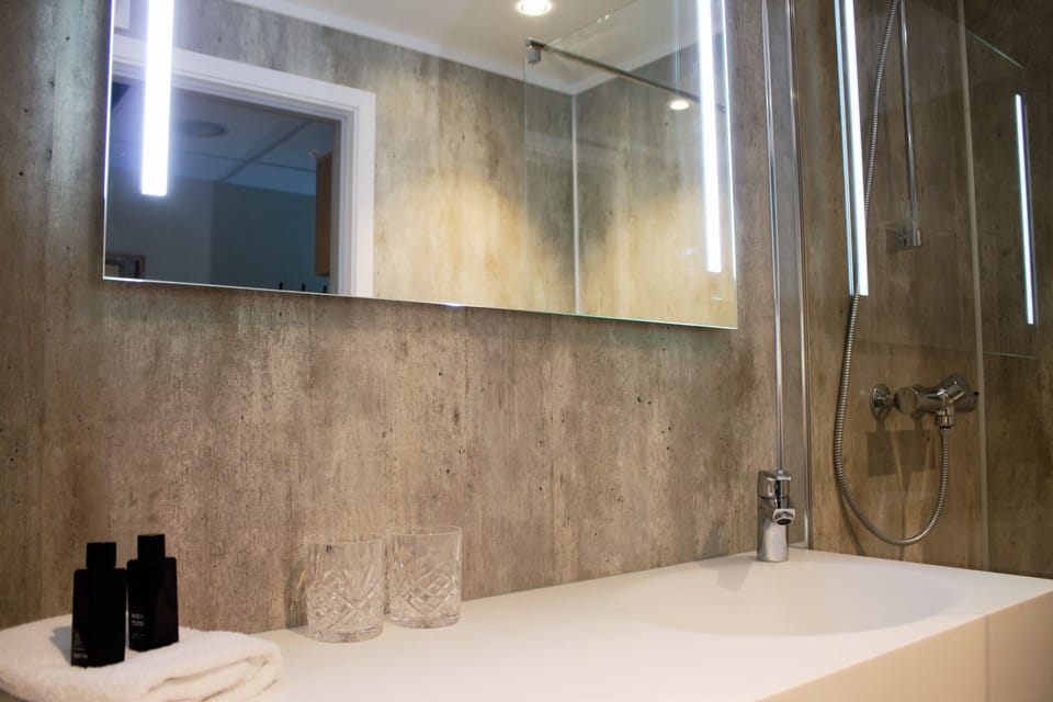 Shower, designer toiletries, hair dryer, heated floors