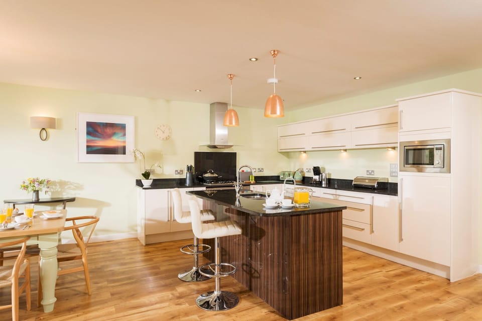 Kitchen with utility room behind and chefs kitchen