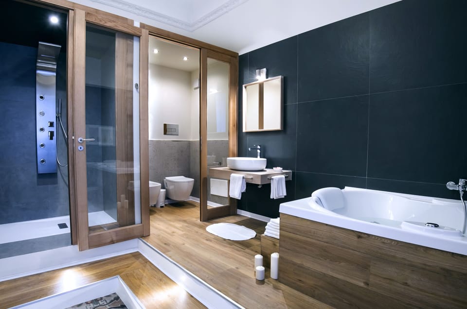 Deluxe Suite, Jetted Tub | Bathroom | Free toiletries, hair dryer, slippers, bidet