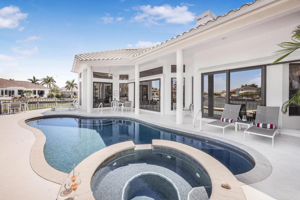 House, Multiple Beds (Waterfront home on key lot with pool,) | Pool | A heated pool