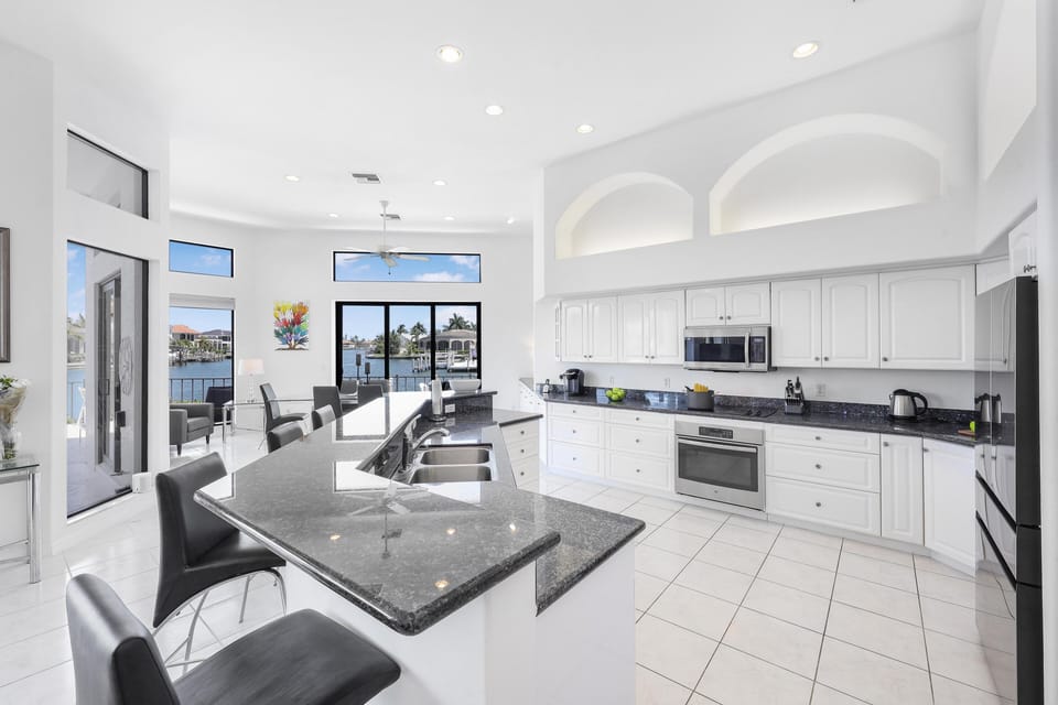 House, Multiple Beds (Waterfront home on key lot with pool,) | Private kitchen | Fridge, microwave, oven, stovetop
