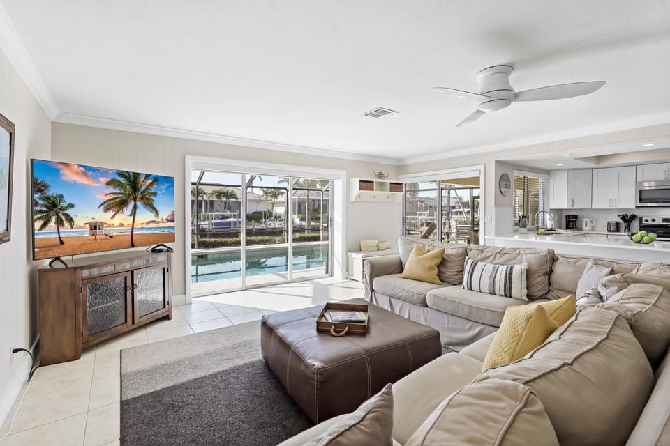 House, Multiple Beds (Waterfront home with pool and western) | Living area | Flat-screen TV