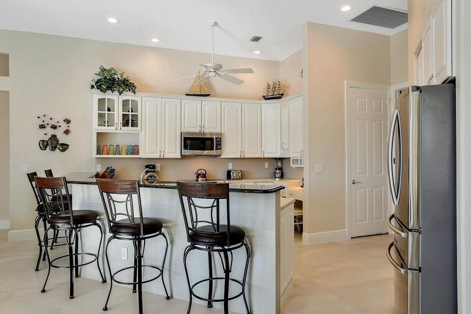 House, Multiple Beds (Waterfront home with pool, spa and wa) | Private kitchen | Fridge, microwave, oven, stovetop