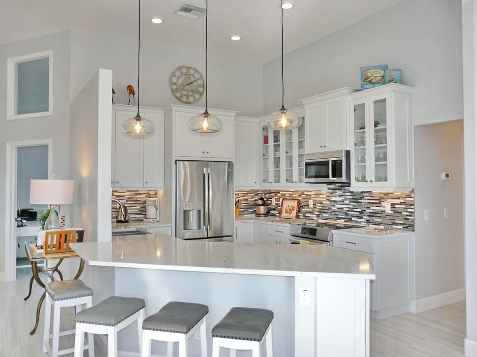House, Multiple Beds (Stylish waterfront home with pool and) | Private kitchen | Fridge, microwave, oven, stovetop