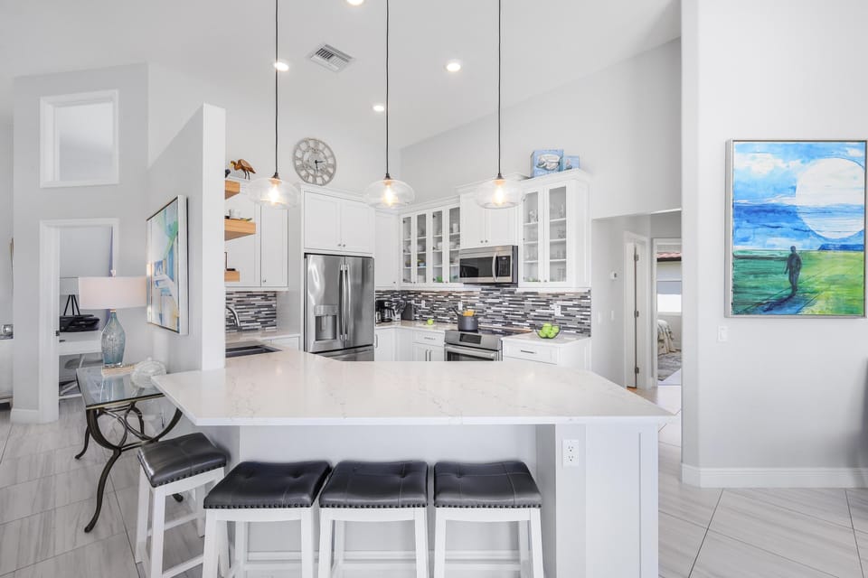 House, Multiple Beds (Stylish waterfront home with pool and) | Private kitchen | Fridge, microwave, oven, stovetop