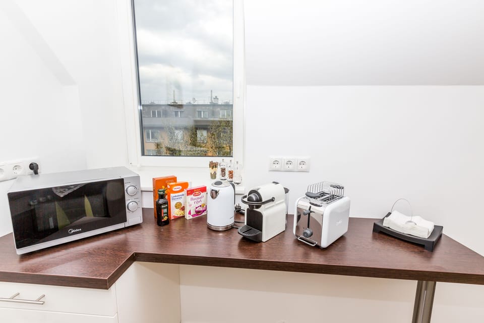 Nespresso machine with sample capsules, tea bags and some welcome gifts