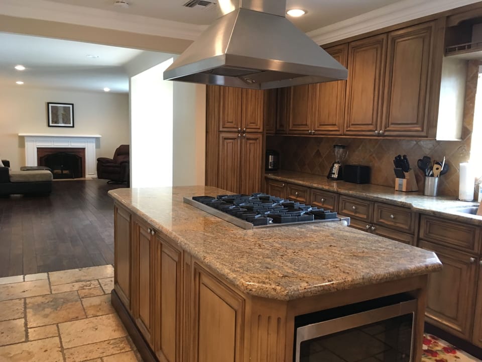 Open concept kitchen opens up to dining room, den and living room straight ahead