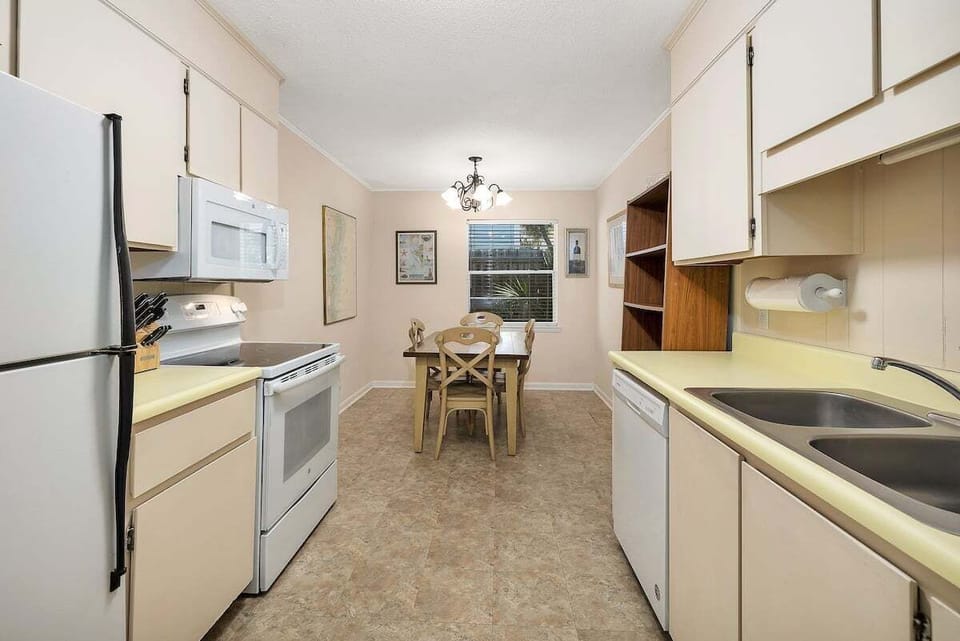 Galley kitchen with dining area