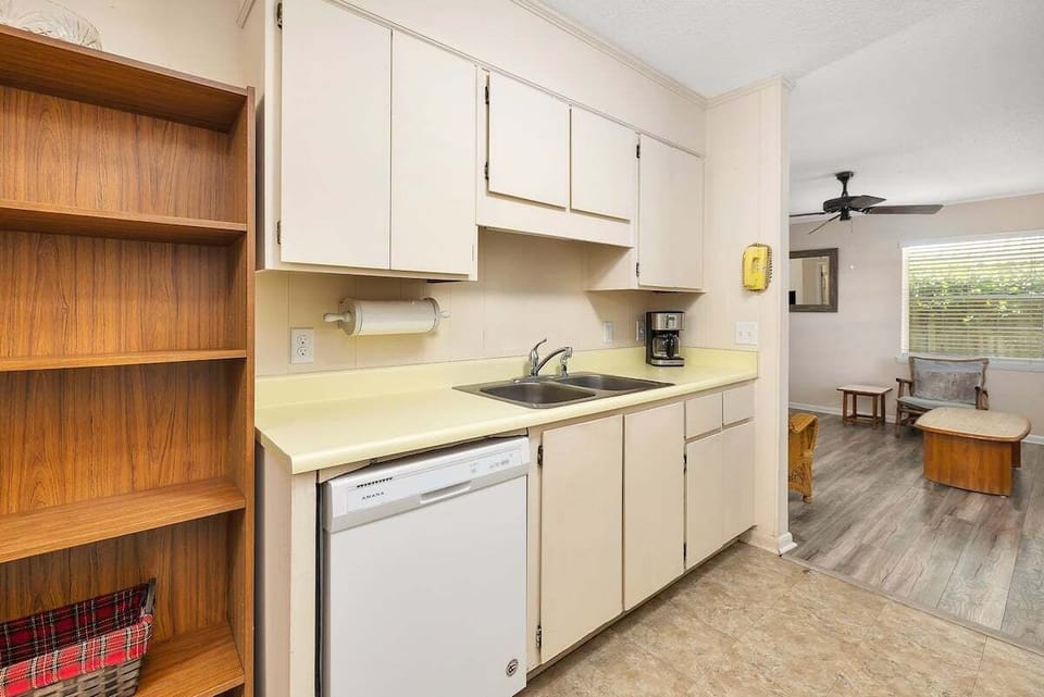 Kitchen with white cabinets and open shelving