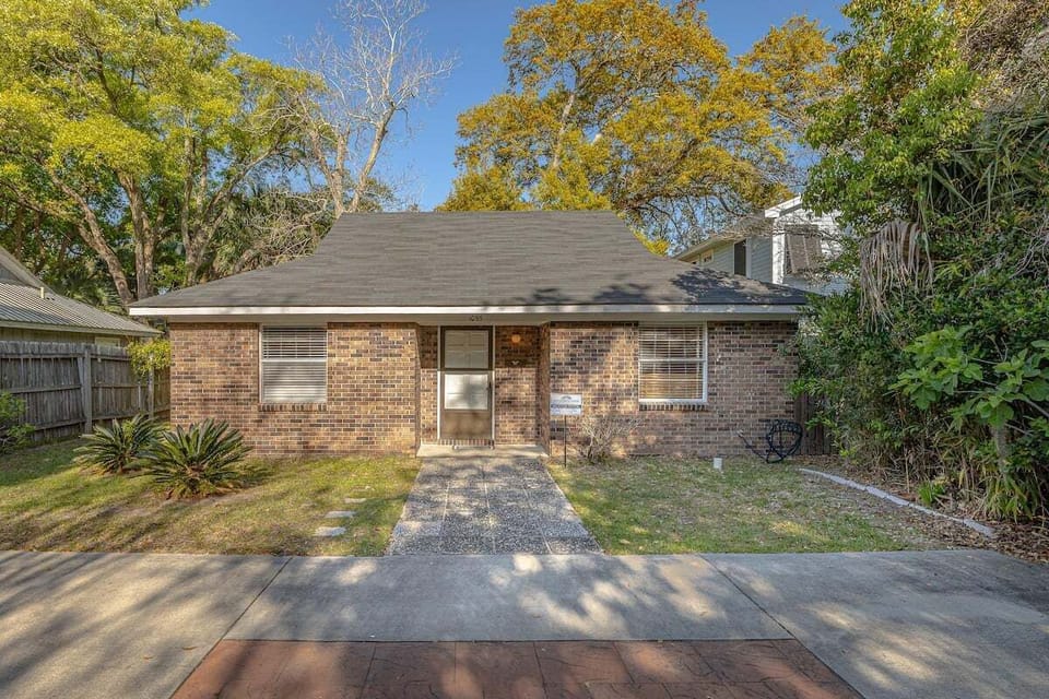 Front view of single-story brick house