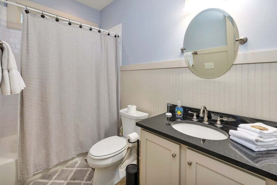 Guest bathroom with vanity and shower