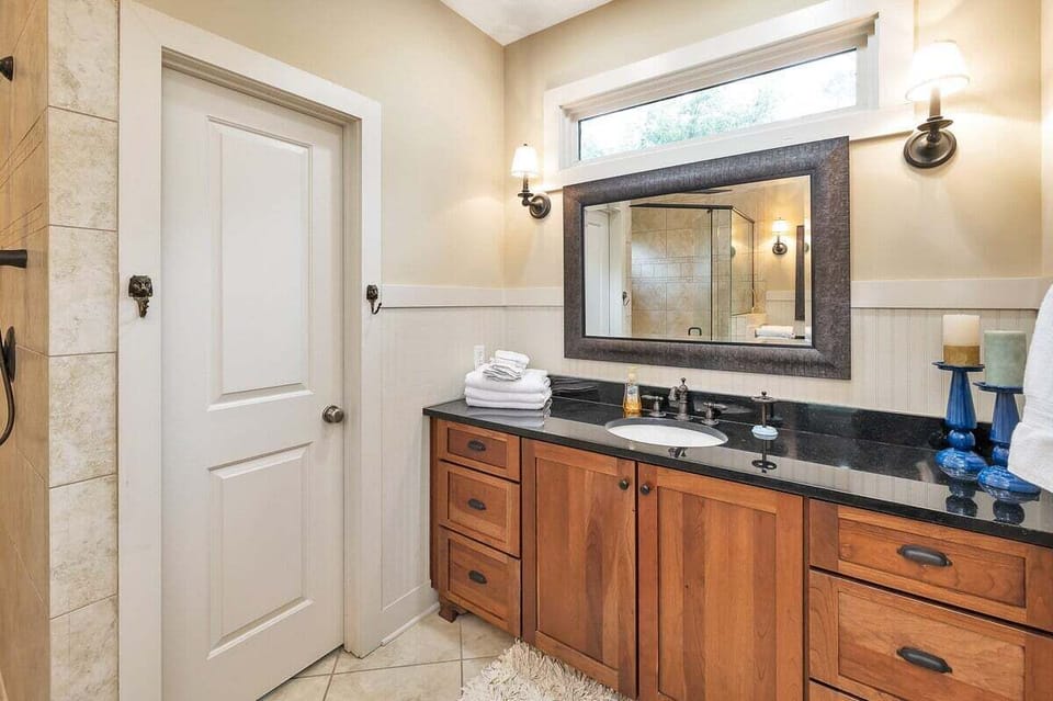 Primary bathroom with wood vanity