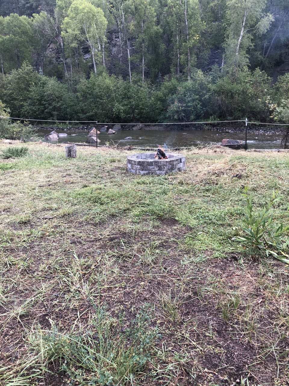 Fire pit in the backyard with river view