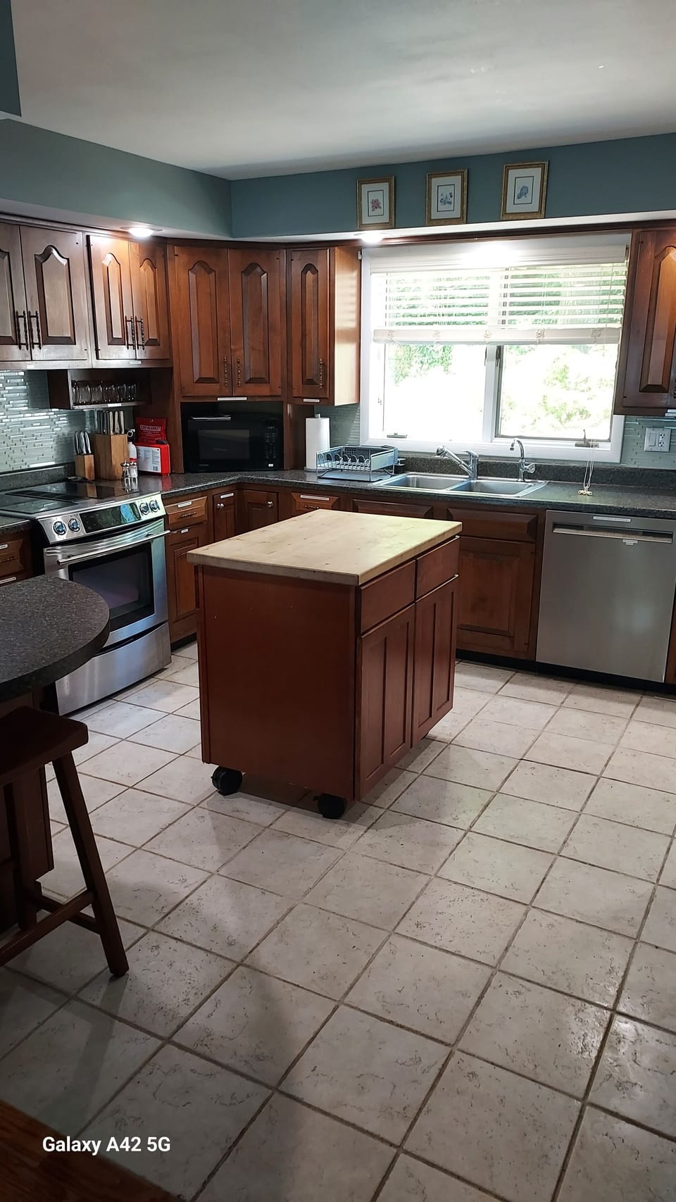 Kitchen view facing west. Moveable island in place.