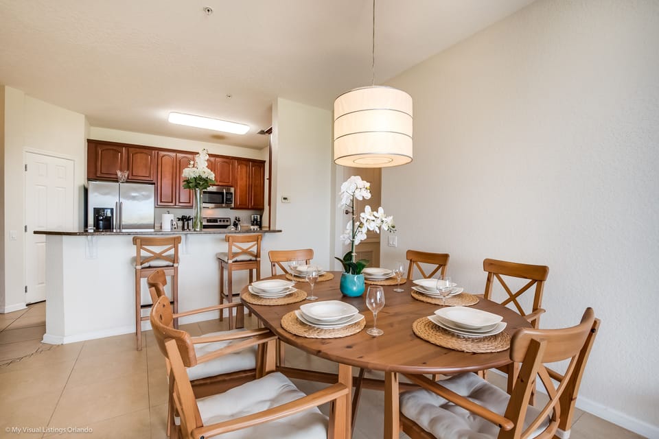 Dining in Style: Experience the epitome of elegance in our condo's dining area, adorned with sleek and sophisticated chairs for a luxurious dining experience