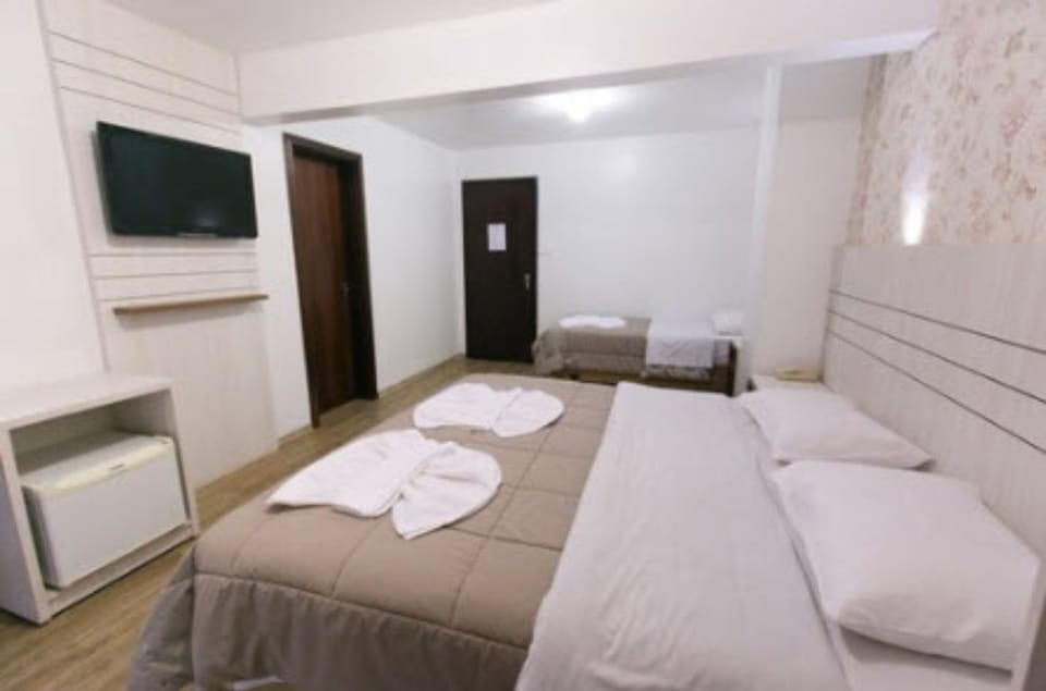 Triple Room | Minibar, desk, blackout drapes, iron/ironing board