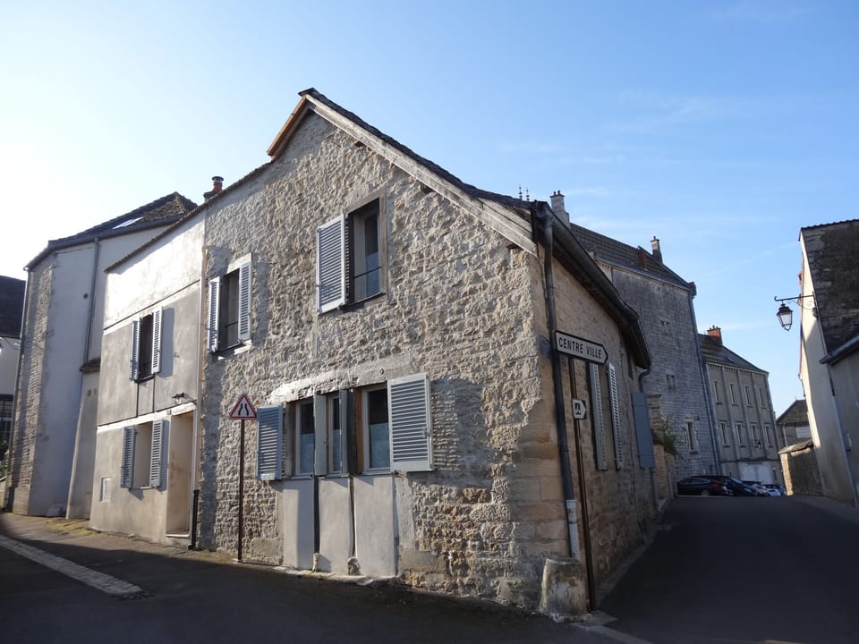 Le Coin exterior, on the left is lane way to village square.