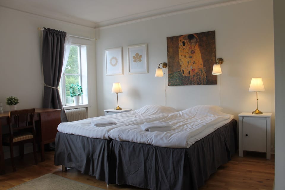 Desk, blackout drapes, iron/ironing board (on request)