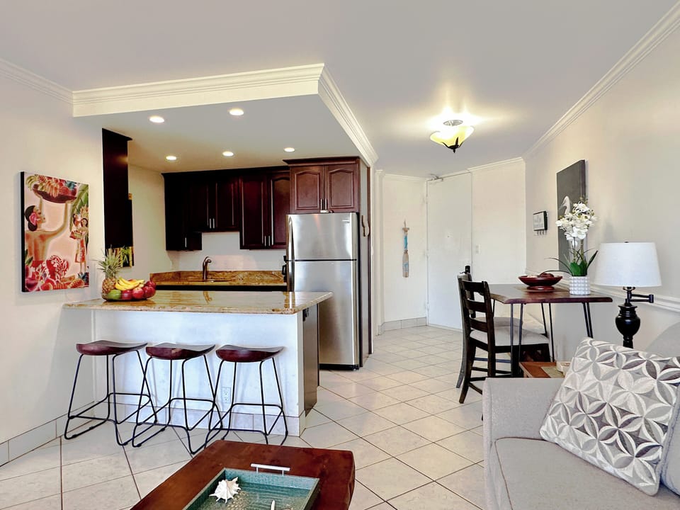 Gather together and mingle at the kitchen counter with bar seating for three.