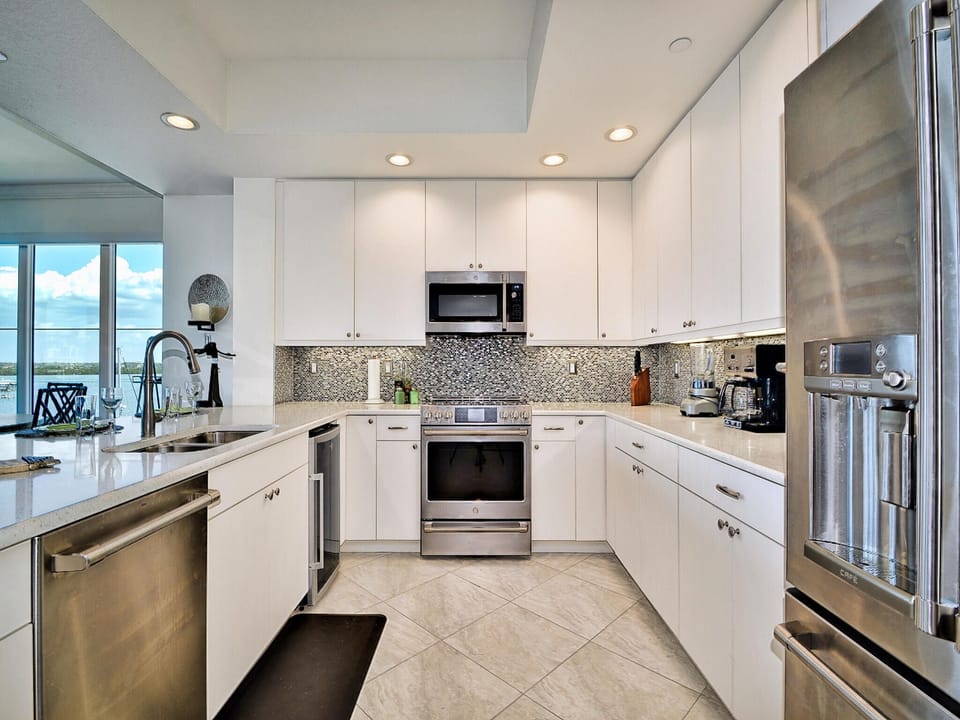 Stainless steel appliances; induction range, wine fridge, dishwasher and refrigerator.
