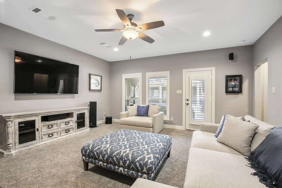 Third floor entertainment/living area with full bathroom and patio