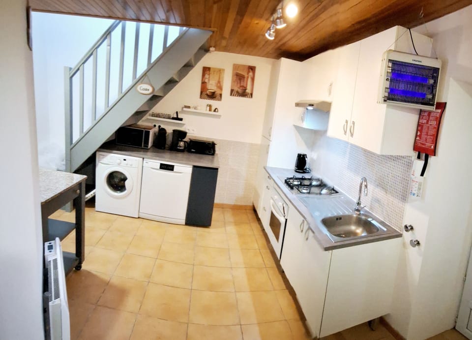 Full kitchen including full size dishwasher and washing machine