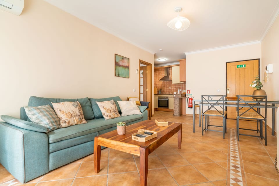 Apartment, 1 Bedroom, Balcony, Garden View | Living area | Flat-screen TV, DVD player, iPod dock