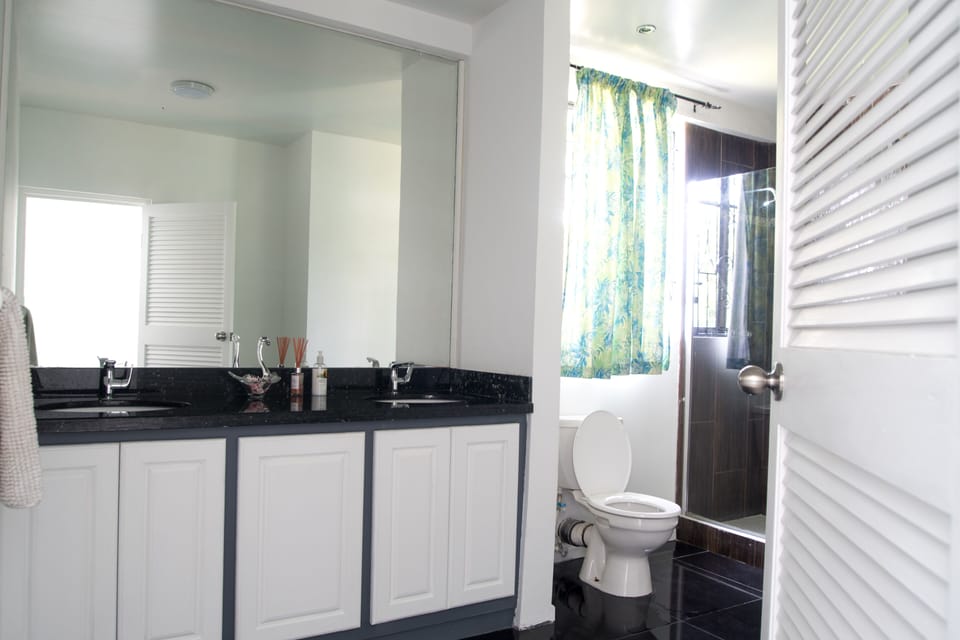 Ensuite with double vanity and granite counters.  Rain-shower  oversize enclosur