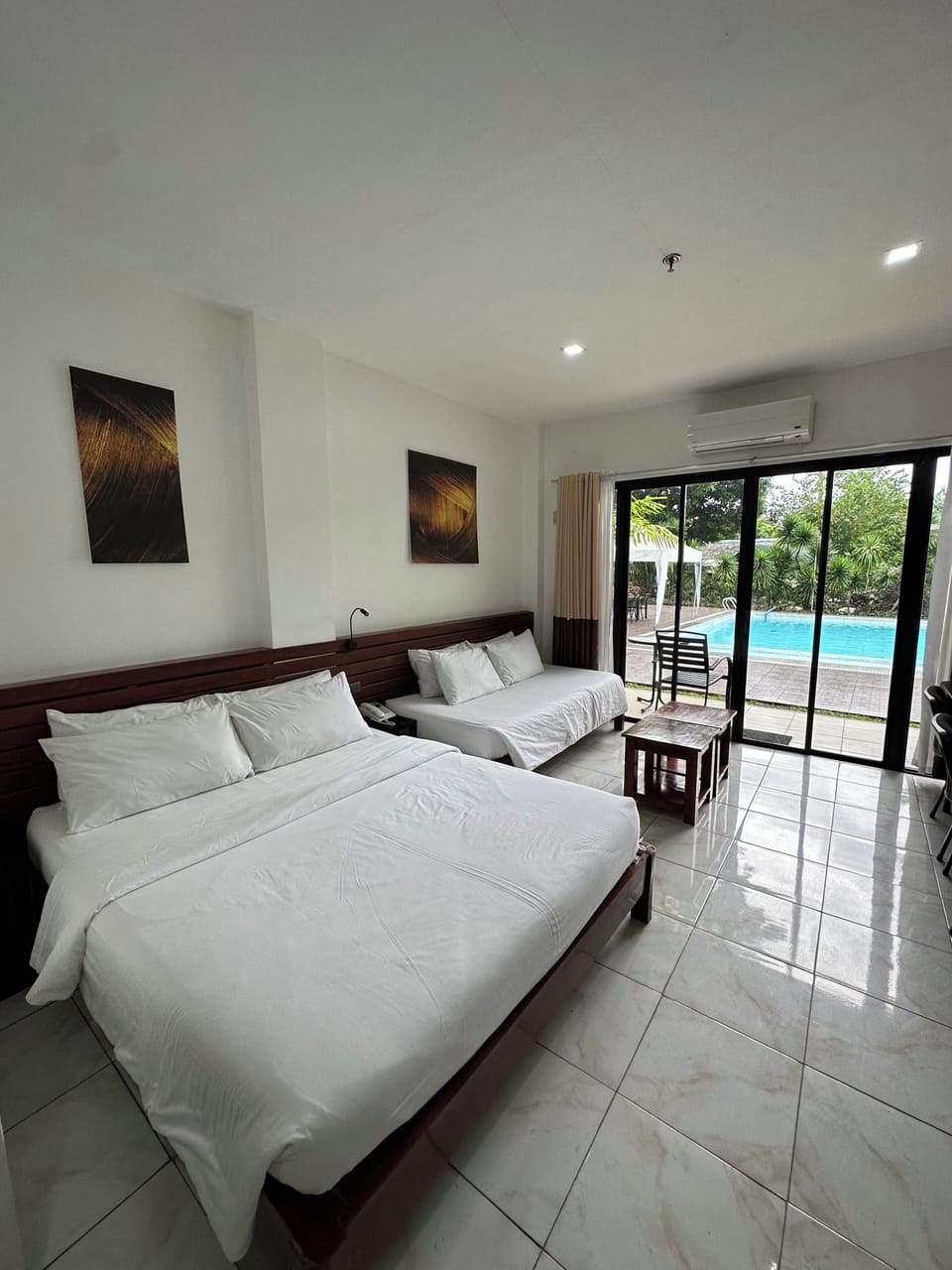 Deluxe Triple Room, Multiple Beds, Pool View, Poolside | Bathroom | Shower, hair dryer (on request), bidet, towels