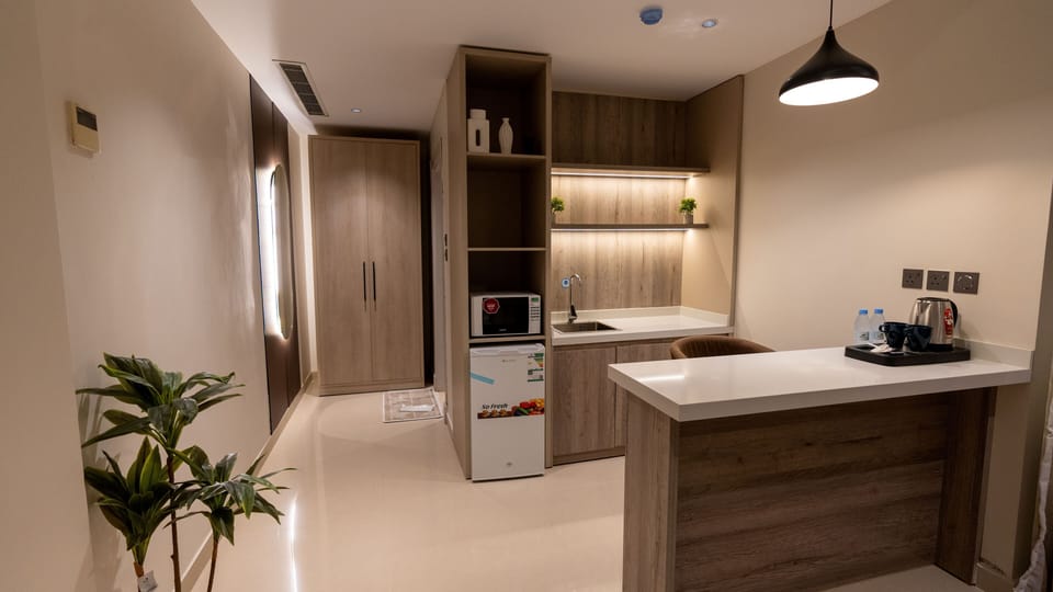 Standard Suite | Private kitchen | Fridge, eco-friendly cleaning products, paper towels