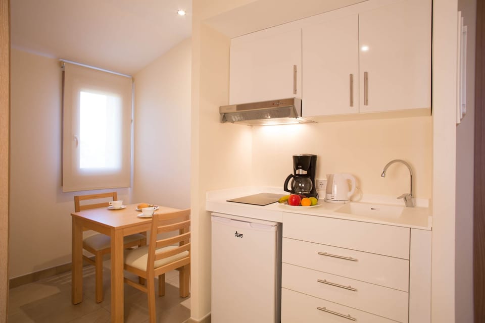 Fridge, stovetop, espresso maker, coffee/tea maker