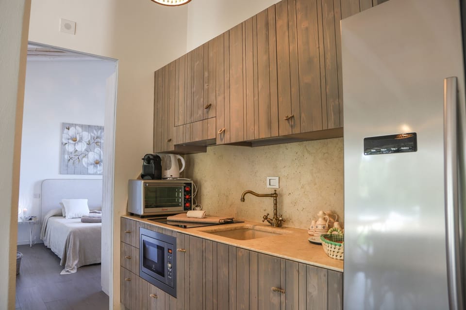 Villa, 4 Bedrooms | Private kitchen | Full-size fridge, microwave, stovetop, dishwasher