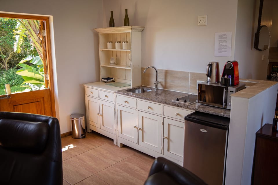 Luxury Chalet, 1 Bedroom, Beach View | Private kitchen | Fridge, coffee/tea maker, electric kettle, highchair