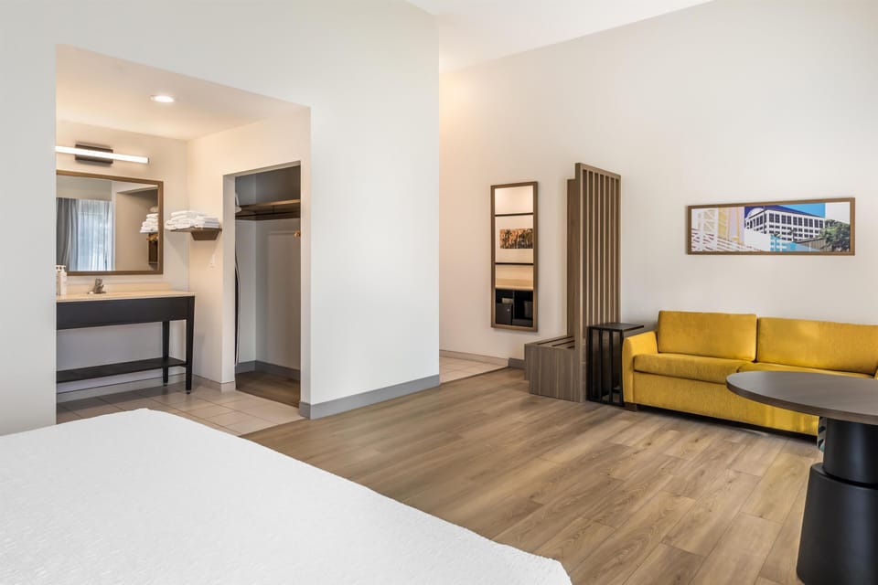 Studio Suite, 1 King Bed, Refrigerator & Microwave | Living area | 32-inch LCD TV with satellite channels, TV
