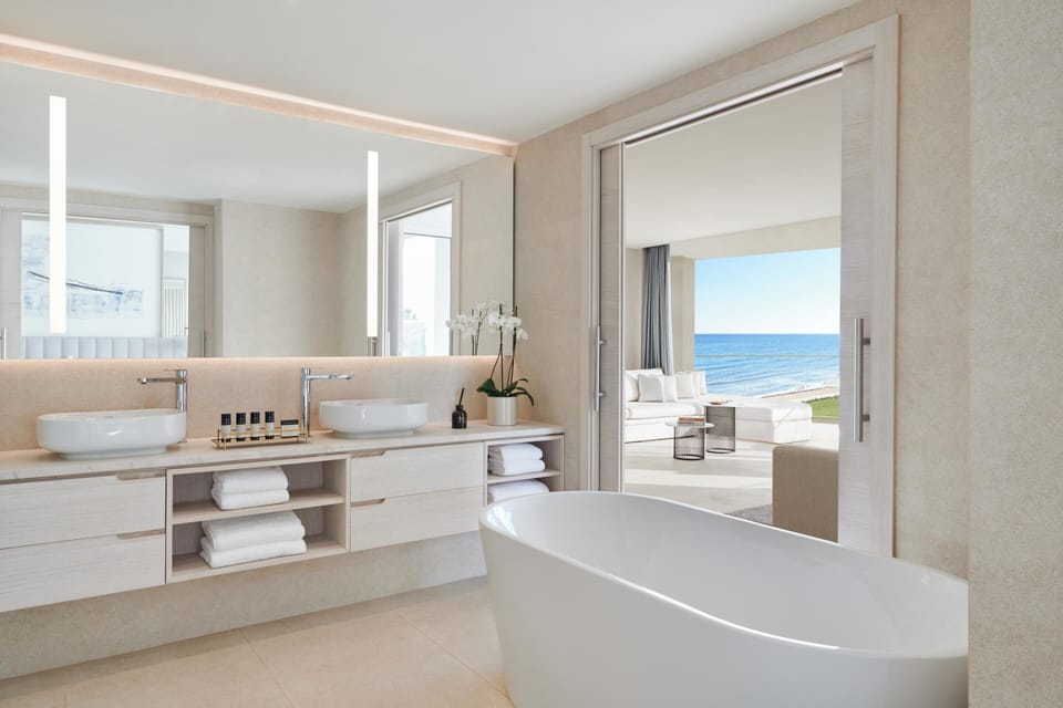 Deluxe Suite, Sea View (Two bedrooms) | Bathroom | Slippers, towels