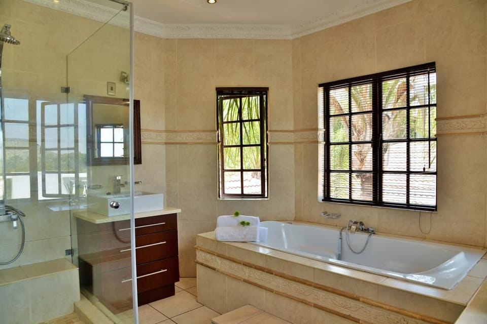Separate tub and shower, jetted tub, rainfall showerhead