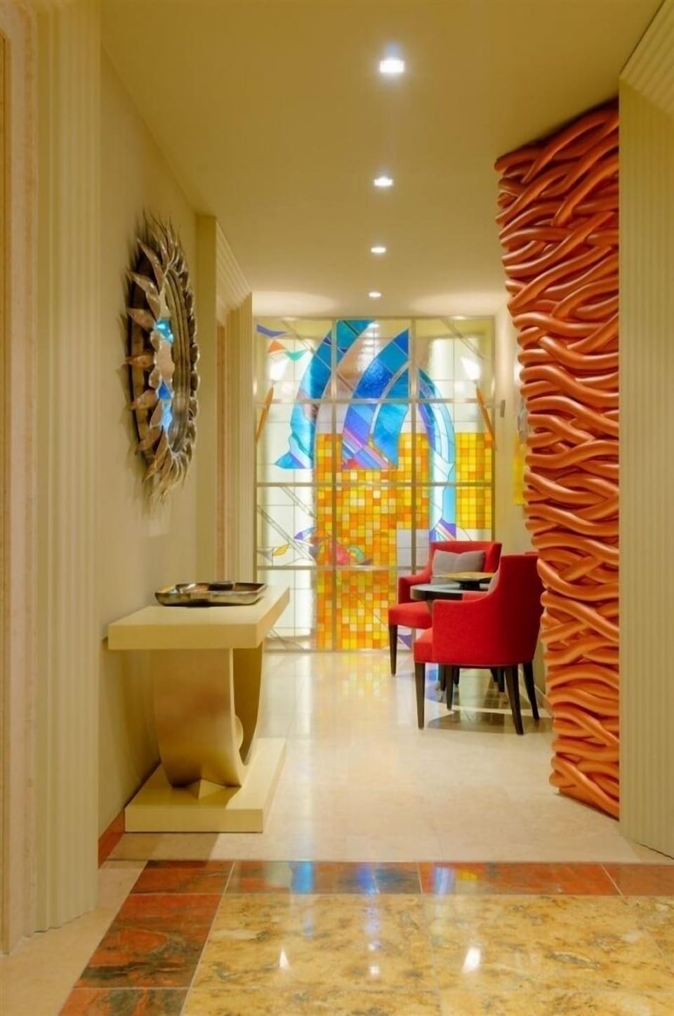 Another view of the bathroom with double sink, toilet and bidet