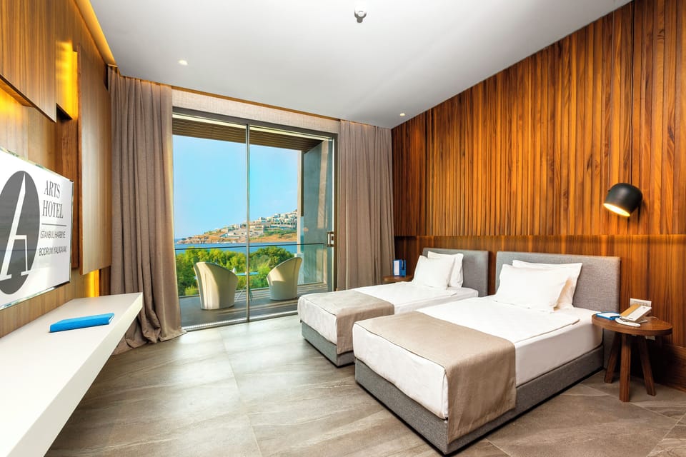 Deluxe Seaview Room with Terrace | Premium bedding, minibar, in-room safe, desk