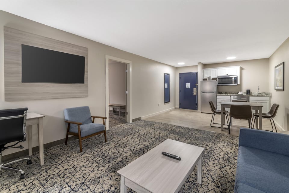 Suite, 1 King Bed, Non Smoking, Kitchenette (with Single Sofabed) | Desk, laptop workspace, blackout drapes, iron/ironing board