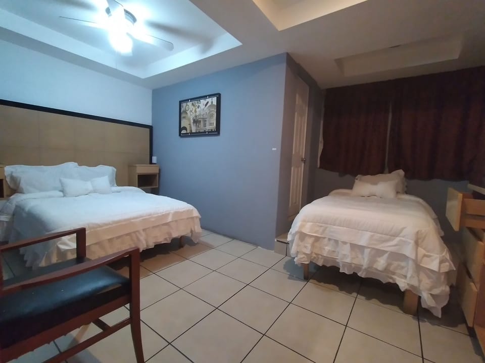 Triple Room | Blackout drapes, iron/ironing board, free WiFi, bed sheets