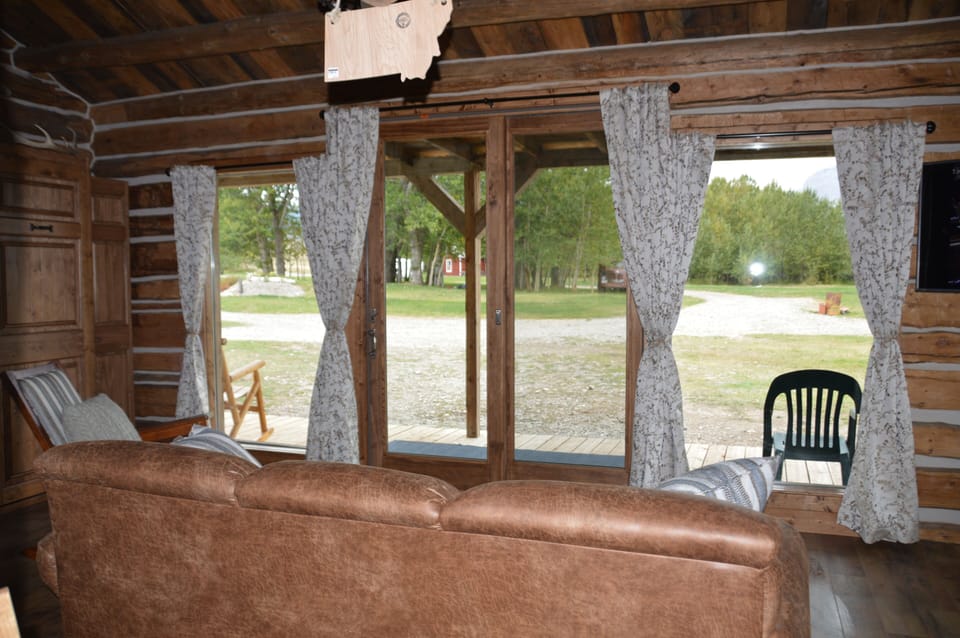 Large picture windows and sliding door overlooking Rocky Mountain front.