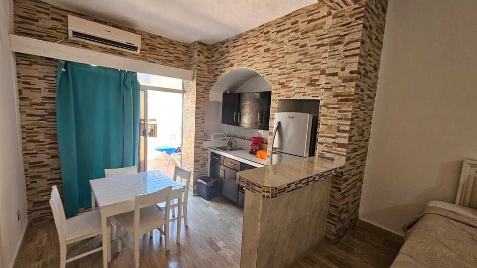 Exclusive Studio Suite, 1 Bedroom, Terrace, Beachfront | Private kitchen | Full-size fridge, microwave, coffee/tea maker, cleaning supplies