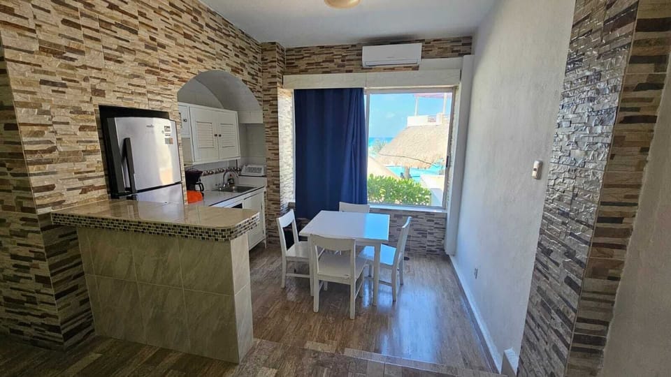 Comfort Studio Suite, 1 Bedroom, Non Smoking, Beachfront | Private kitchen | Full-size fridge, microwave, coffee/tea maker, cleaning supplies