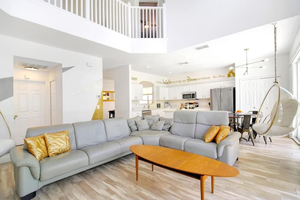 Our reclining, top grade Norwegian leather,  sectional couch in the open floor plan living room is just the place to relax and talk about park day highlights after the kiddos crash, the house is quiet, with a glass of your favorite beverage!