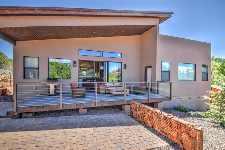Entertainment area with comfortable seating and gas grill