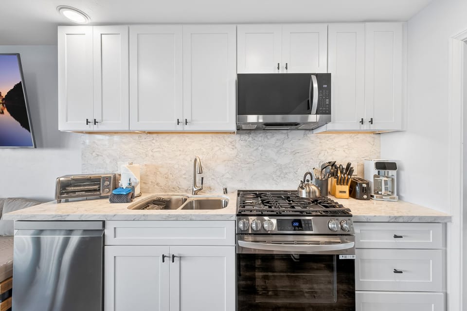 Cook and entertain in the modern, fully equipped kitchen, perfect for family meals and preparing fresh dishes after a day at the beach.