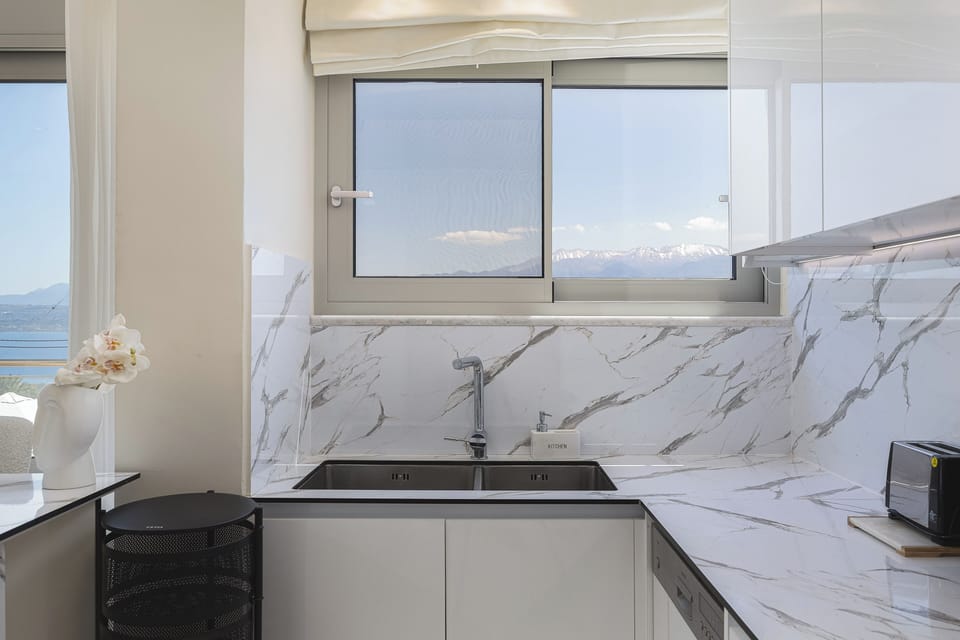First Floor - The fully equipped kitchen provides all essentials for a self-catered holiday and your family meals, as well as a breakfast counter for 4.