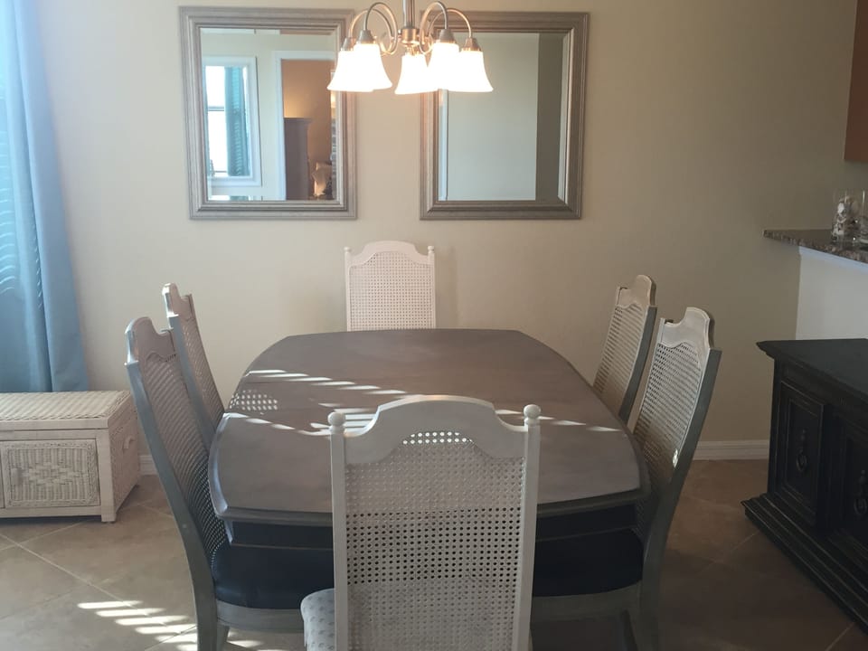 Dinning table 6 comfortable chairs and black buffet 