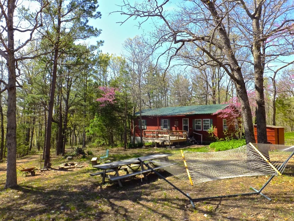 Cottage secluded on a bluff above the river.  This is a place you'll discover.