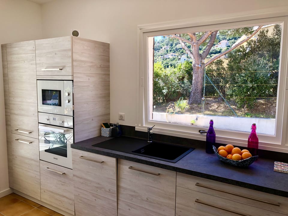 Kitchen equipped with microwave oven dishwasher